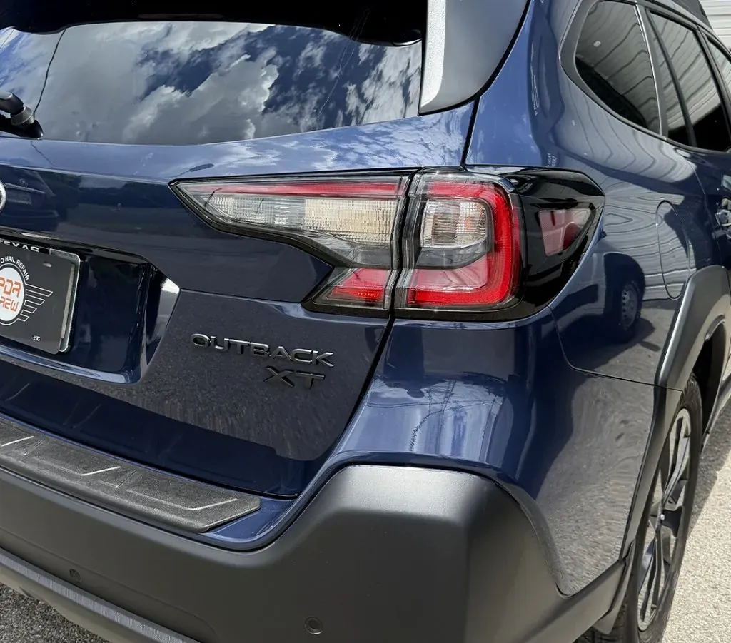 Rear-corner impact on a Subaru Outback XT — after