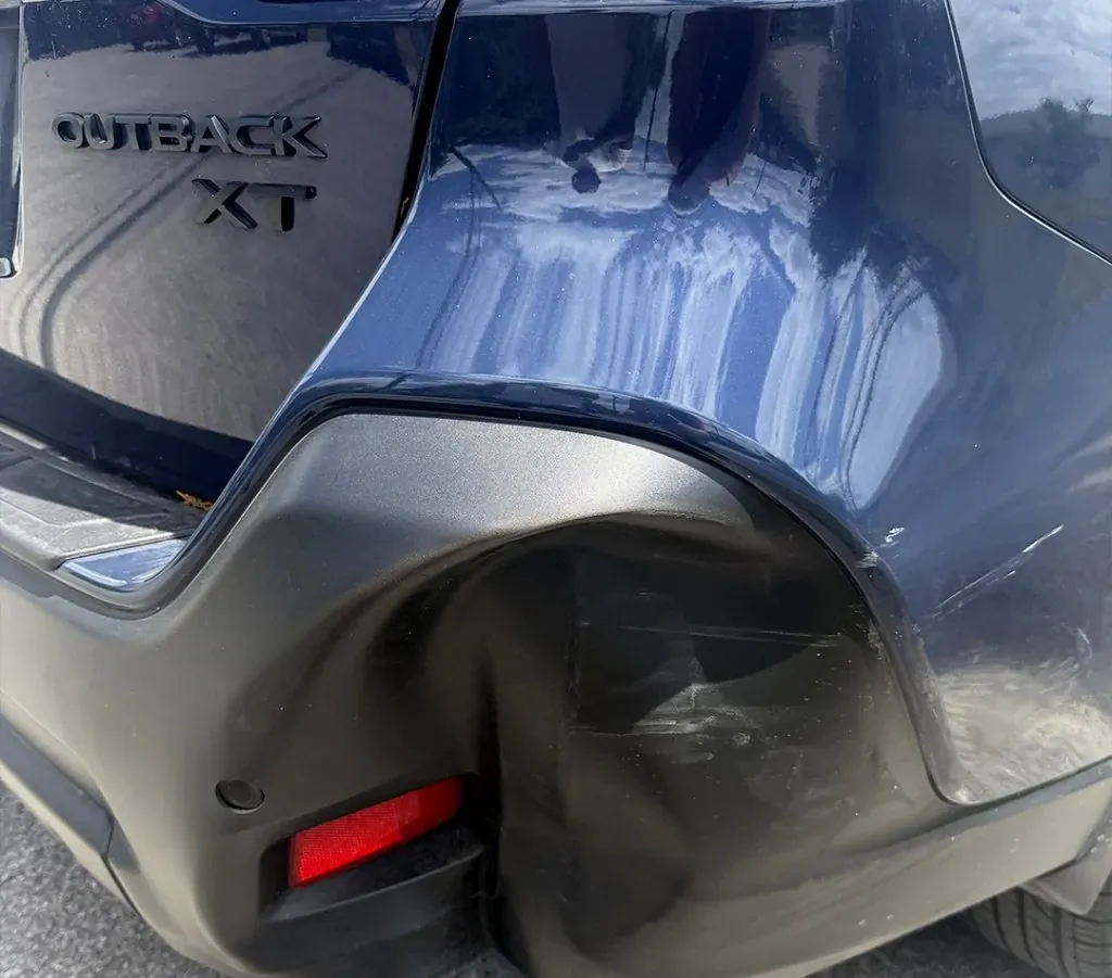 Rear-corner impact on a Subaru Outback XT — before