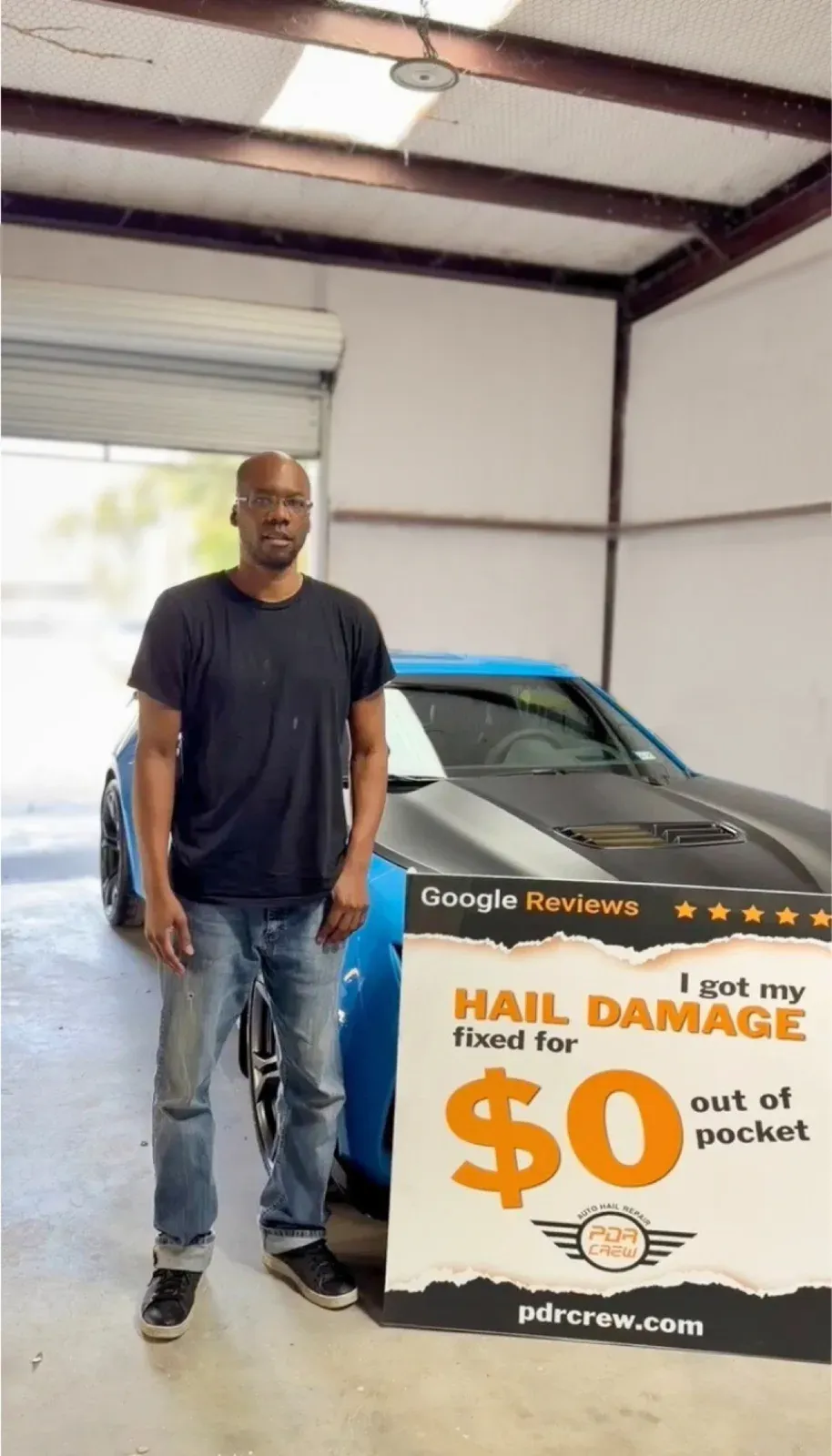 PDR Crew customer next to his car after hail repair