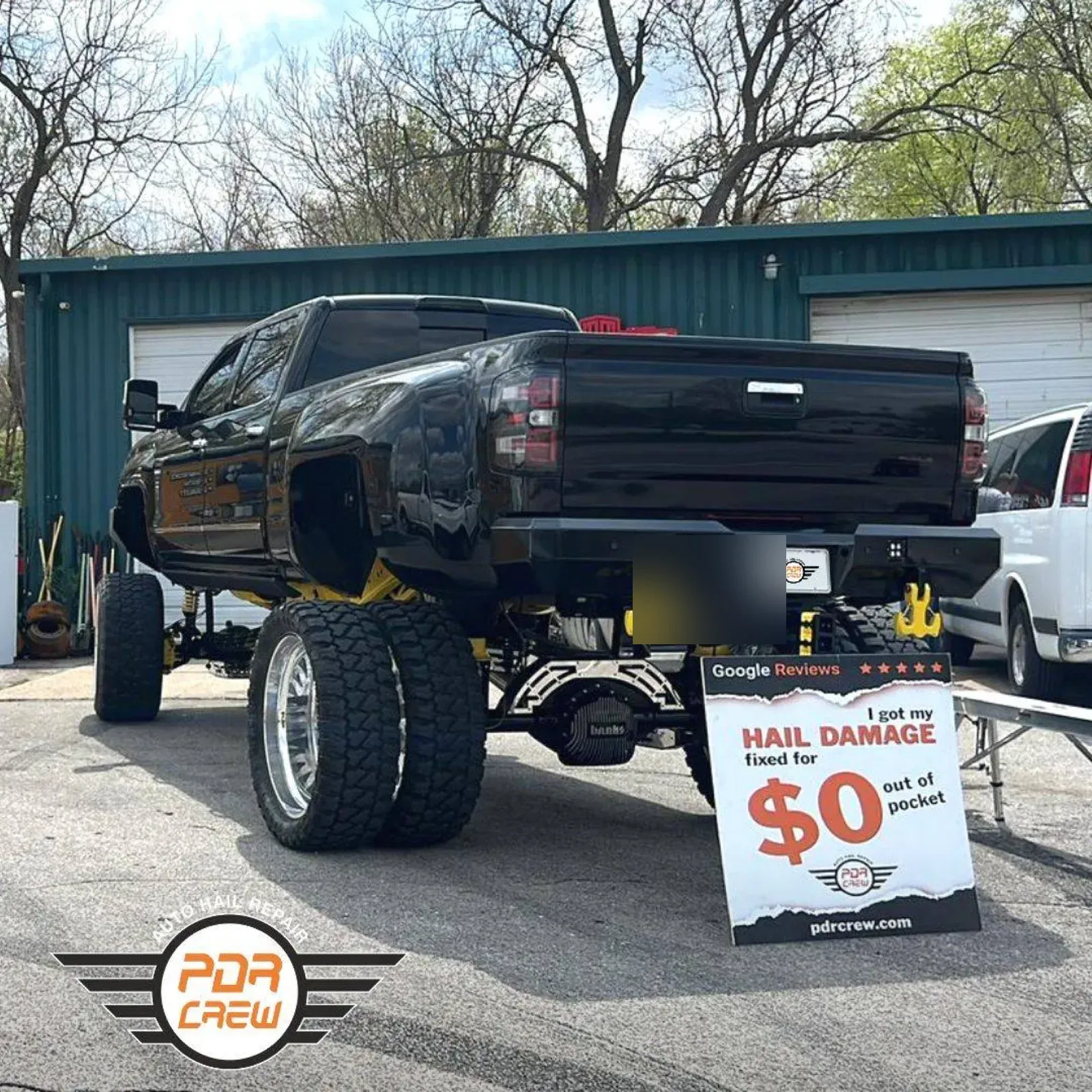 Lifted pickup truck after hail repair