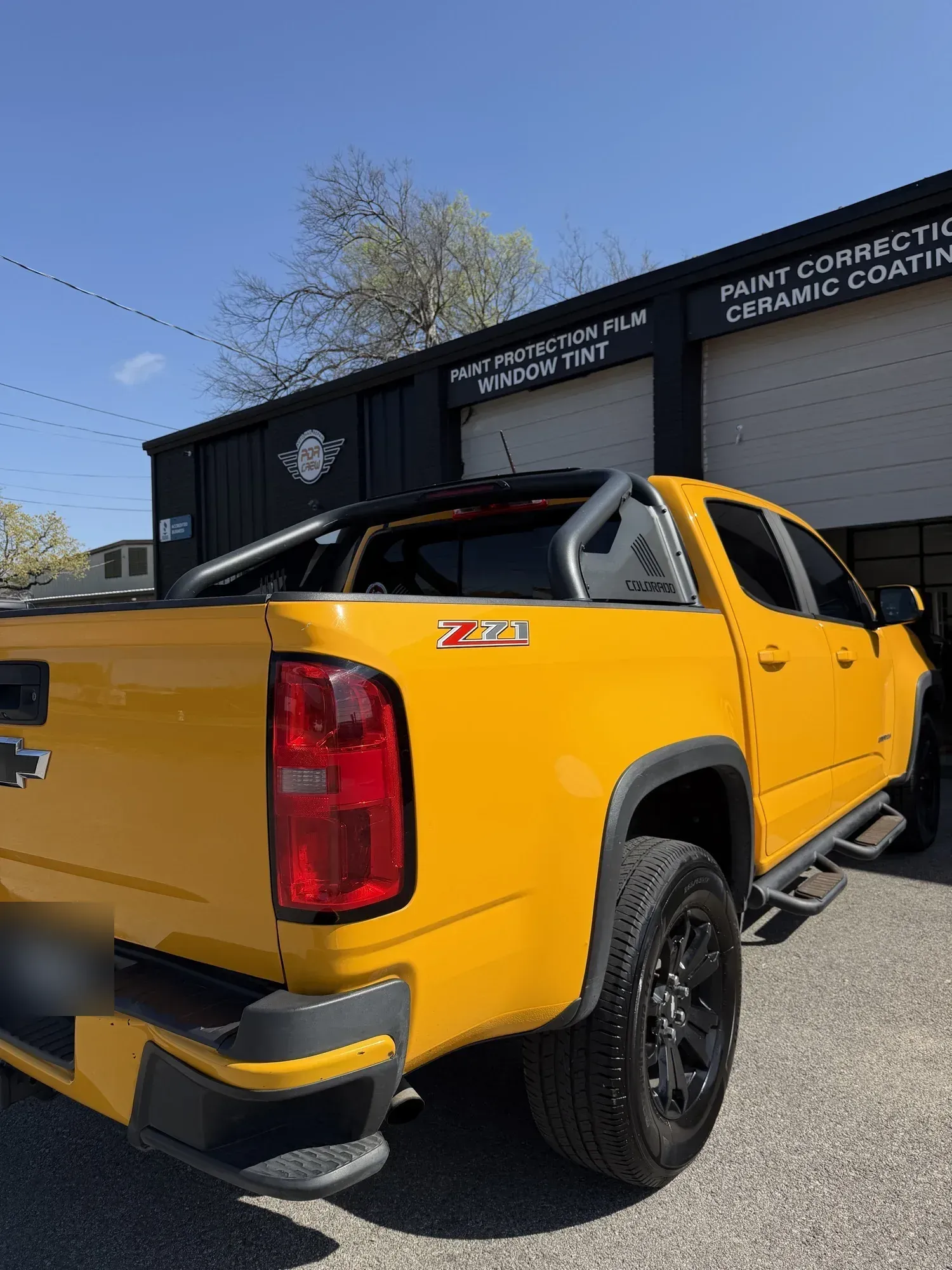 Yellow Chevrolet Colorado ZR2 outside the PDR Crew shop after paint work