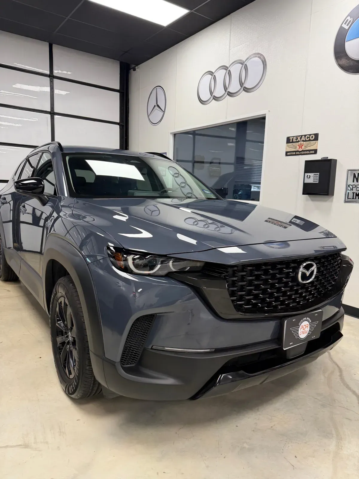Gray Mazda CX-50 in the PDR Crew shop