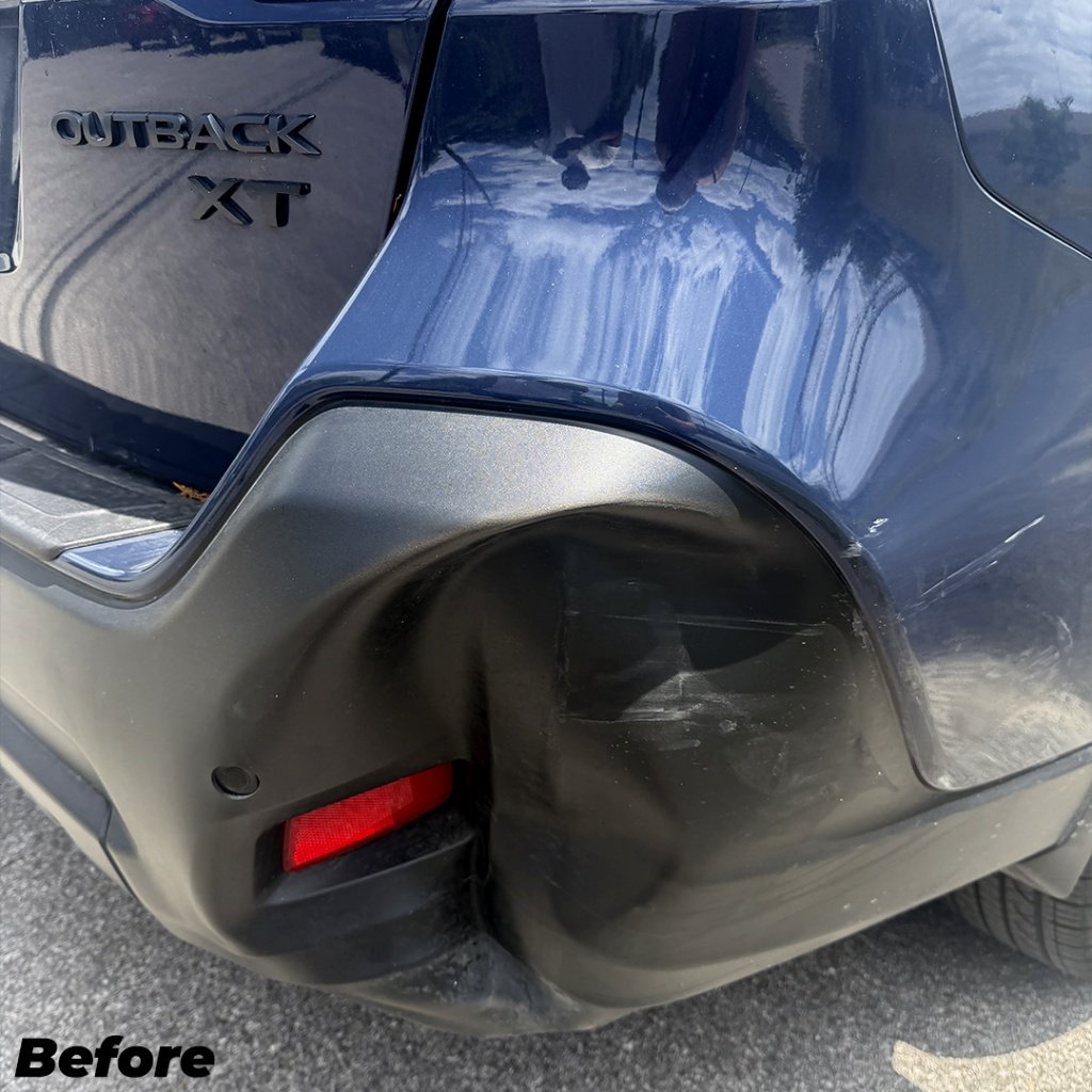 Subaru Outback rear bumper dent before repair