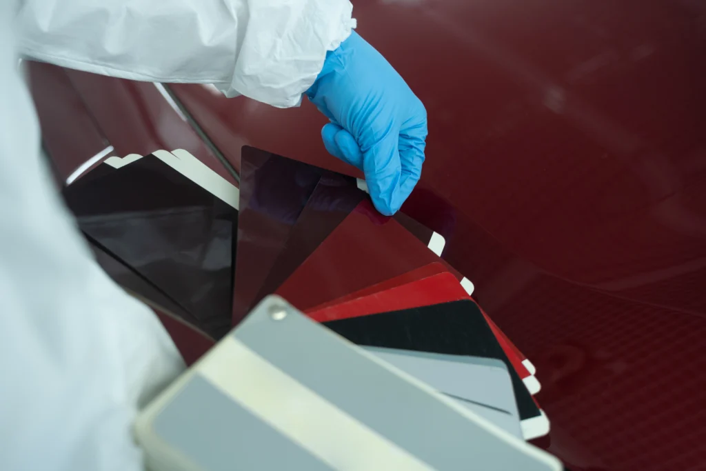 car painter chooses auto body color with samples